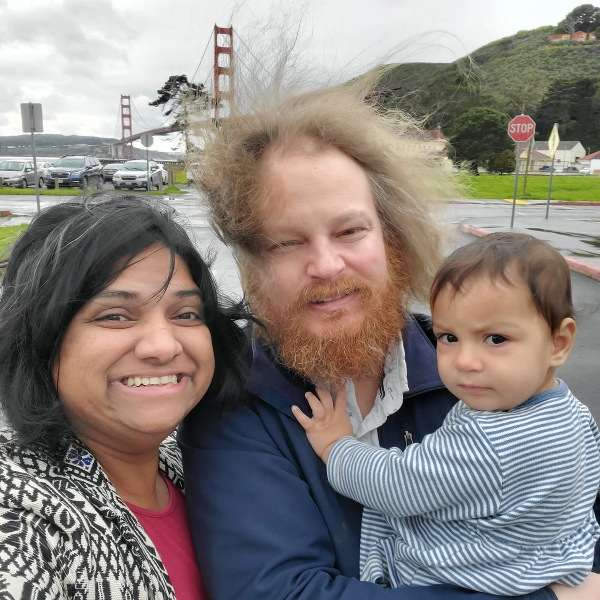 Rashmi with her husband and daughter near the Golden Gate Bridge